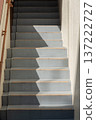 Stairs that are half sunlit and half shaded 137222727