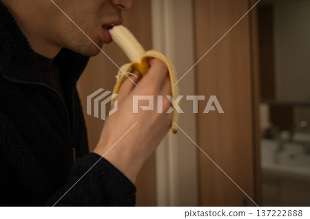 Man eating banana Man eating banana 137222888