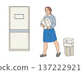 woman carrying cardboard box near door with stacked parcels. 137222921