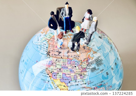 Businessmen meeting on a globe Businessmen meeting on a globe 137224285