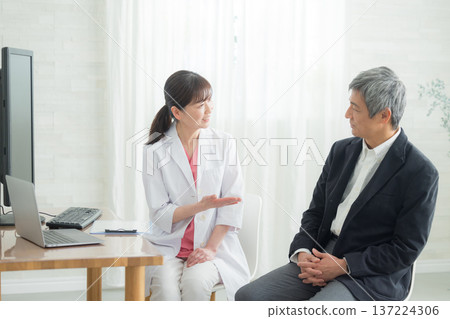 Doctor examining a senior man Doctor examining a senior man 137224306