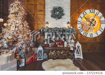 Beautiful holdiay living room with lots of presents under decorated christmas tree, fireplace and huge clock on wooden wall. Winter holiday design and decorations background Beautiful holdiay living room with lots of presents under decorated christmas tree, fireplace and huge clock on wooden wall. Winter holiday design and decorations background 137224518