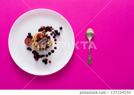Healthy breakfast, dieting and detox concept - wholegrain fresh oatmeal porridge on plate with fruits, berries and nuts. Still life, shallow depth of field Healthy breakfast, dieting and detox concept - wholegrain fresh oatmeal porridge on plate with fruits, berries and nuts. Still life, shallow depth of field 137224550