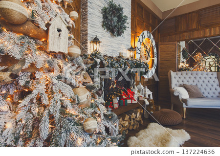 Beautiful christmas interior. Warm room with fireplace, decorated christmas tree, lots of presents and huge clock on wooden wall. Cozy home for winter holidays, copy space, side view Beautiful christmas interior. Warm room with fireplace, decorated christmas tree, lots of presents and huge clock on wooden wall. Cozy home for winter holidays, copy space, side view 137224636