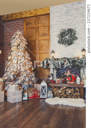 Beautiful holdiay decorated living room with Christmas tree and fireplace. Winter holiday design and decorations background 137224671