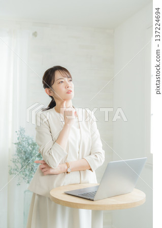 Woman using a laptop 137224694