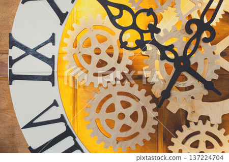 Huge fairy like clock with watch mechanism. Magical golden clock dial closeup Huge fairy like clock with watch mechanism. Magical golden clock dial closeup 137224704