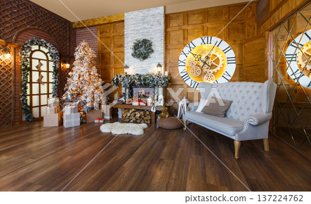 Beautiful christmas interior. Warm room with fireplace, decorated christmas tree and lots of presents 137224762