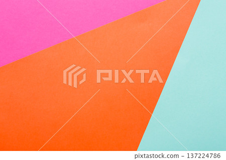 Brightly colored paper shapes in pink, orange, and light blue are layered on a flat surface, creating a vibrant and modern abstract design. This composition showcases creativity and artistic play. Brightly colored paper shapes in pink, orange, and light blue are layered on a flat surface, creating a vibrant and modern abstract design. This composition showcases creativity and artistic play. 137224786
