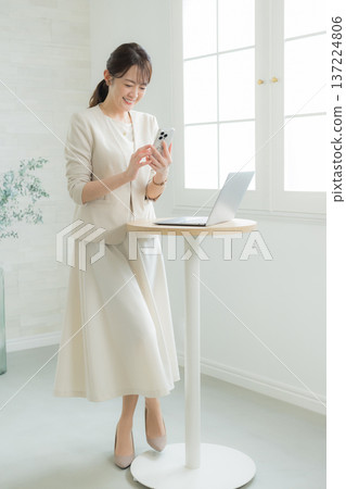 Woman using a laptop 137224806