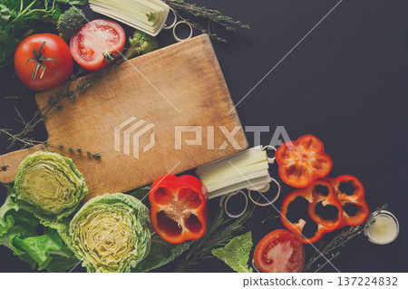Cooking healthy food background. Fresh organic vegetables on black. Natural food with copy space. Cooking healthy food background. Fresh organic vegetables on black. Natural food with copy space. 137224832