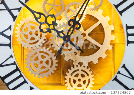 Huge fairy like clock with watch mechanism. Magical golden clock dial closeup Huge fairy like clock with watch mechanism. Magical golden clock dial closeup 137224862
