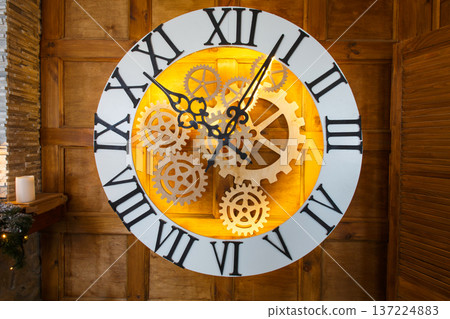 Huge fairy like clock with watch mechanism. Magical golden clock dial closeup Huge fairy like clock with watch mechanism. Magical golden clock dial closeup 137224883