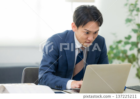 A serious looking businessman A serious looking businessman 137225211