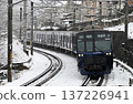 Sotetsu 21000 series train running through falling snow 137226941