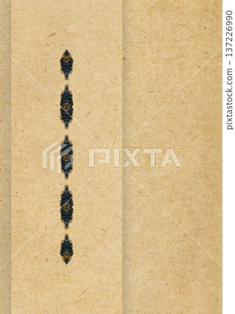 Kraft paper background with vertical row of symmetrical ornamental decorative elements and clean copy space, featuring recycled paper texture. Rustic vintage layout for creative design projects. Kraft paper background with vertical row of symmetrical ornamental decorative elements and clean copy space, featuring recycled paper texture. Rustic vintage layout for creative design projects. 137226990