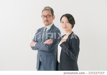 Men and women in suits with arms crossed Men and women in suits with arms crossed 137227157