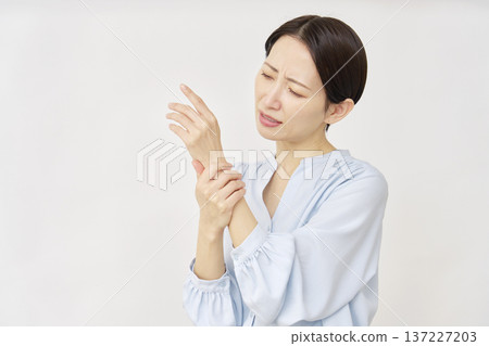 Woman in her 40s, rash, white background Woman in her 40s, rash, white background 137227203