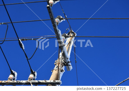 Snow on a utility pole Snow on a utility pole 137227725
