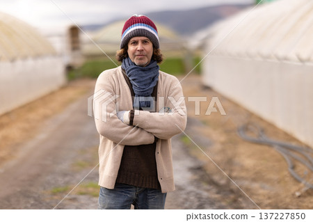 Portrait of Caucasian male plantation garden owner standing next to greenhouse Portrait of Caucasian male plantation garden owner standing next to greenhouse 137227850