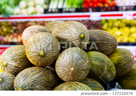 Bunch of melons in store 137228374