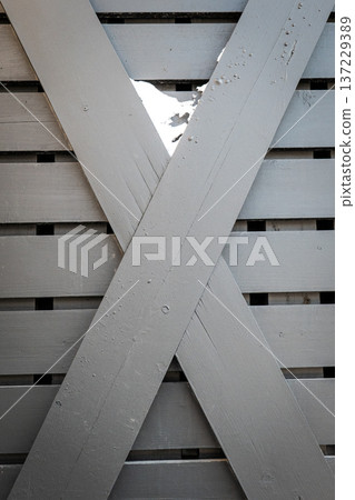 Crossed Painted Wooden Slats Forming Structural X Pattern Detail 137229389