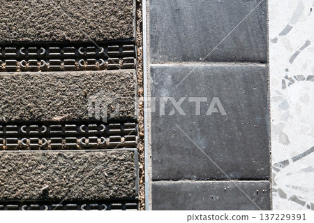 Public Entrance Floor Mat Adjacent To Stone Tile Walkway Surface 137229391