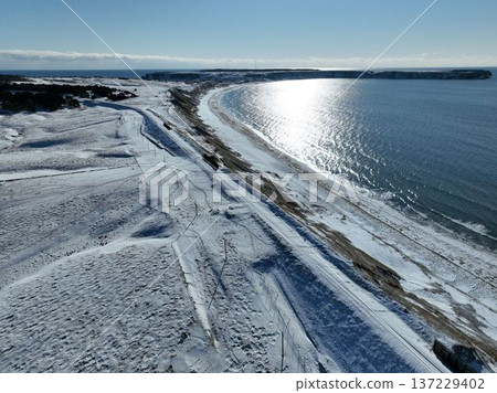 Winter aerial view of the Nemuro Main Line near Cape Ochiishi, overlooking the Pacific coast 137229402