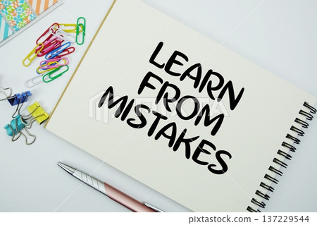 Learn From Mistakes text message written on notepad with stationery flat lay on white background 137229544