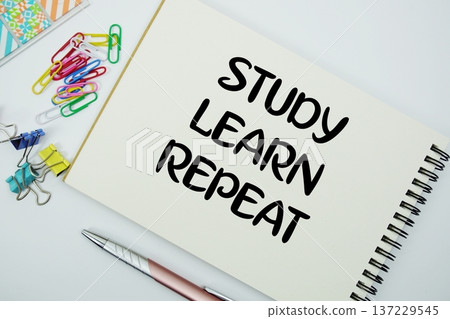 Study, Learn, Repeat text message written on notepad with stationery flat lay on white background Study, Learn, Repeat text message written on notepad with stationery flat lay on white background 137229545