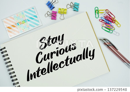 Stay Curious Intellectually text message written on notepad with stationery flat lay on white background Stay Curious Intellectually text message written on notepad with stationery flat lay on white background 137229548
