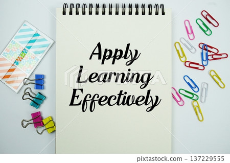 Apply Learning Effectively text message written on notepad with stationery flat lay on white background Apply Learning Effectively text message written on notepad with stationery flat lay on white background 137229555