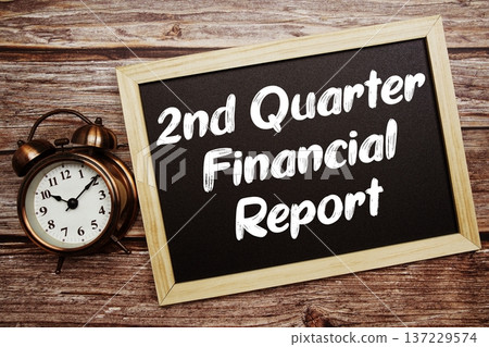 2nd Quarter Financial Report text on Blackboard and alarm clock on wooden background 2nd Quarter Financial Report text on Blackboard and alarm clock on wooden background 137229574