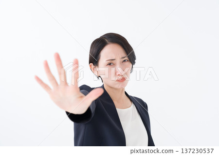 Businesswoman stopping with her hand 137230537