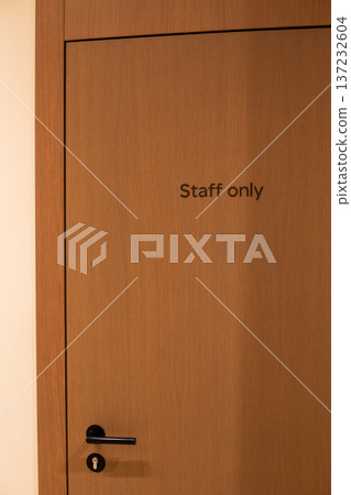 Entrance to staff quarters. Sign on wooden door states that only staff are allowed entry. Secret room for special occasions. Entry prohibited. Entry is permitted for staff only 137232604