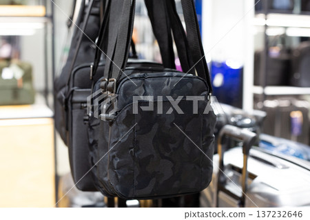 Compact black crossbody and shoulder bags. Selection of different compact bags for men. Men accessory for carrying small items. Storage for phone, keys, and documents. Small shoulder bag Compact black crossbody and shoulder bags. Selection of different compact bags for men. Men accessory for carrying small items. Storage for phone, keys, and documents. Small shoulder bag 137232646