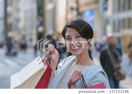 Close-up of a smiling woman shopping in Ginza 137233296