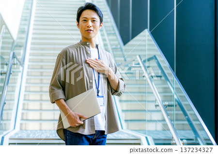 Middle-aged man in the office corridor 137234327