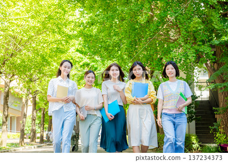 Female college student walking outside Female college student walking outside 137234373