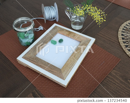 Framed sea glass. Creating art from natural materials. Hobbies and creativity. Recycling, nature, and ecology. Framed sea glass. Creating art from natural materials. Hobbies and creativity. Recycling, nature, and ecology. 137234540