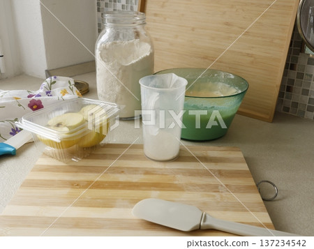 Ingredients for apple pie on kitchen table. High-quality homemade farm products. Healthy eating. Traditional Italian cuisine. 137234542