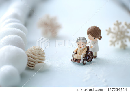 The gentle world of wheelchairs and caregivers in a snow-lit winter 137234724