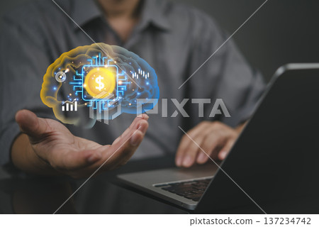 Businessman hand holding virtual brain with dollar money chip using laptop computer. AI technology concept for financial investment growth. Smart fintech economy profit mindset strategy innovation. 137234742
