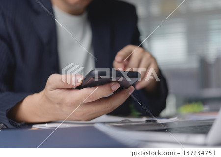 Person fingers touching cellphone screen analyzing financial stock graph. Entrepreneur monitoring business growth data online app. Modern connectivity network success strategy. 137234751