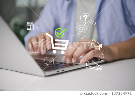 Man hands using laptop online shopping. E-commerce technology virtual interface cart icon checkmark. Customer buying product digital store. Retail marketing payment chatbot support concept. Man hands using laptop online shopping. E-commerce technology virtual interface cart icon checkmark. Customer buying product digital store. Retail marketing payment chatbot support concept. 137234771