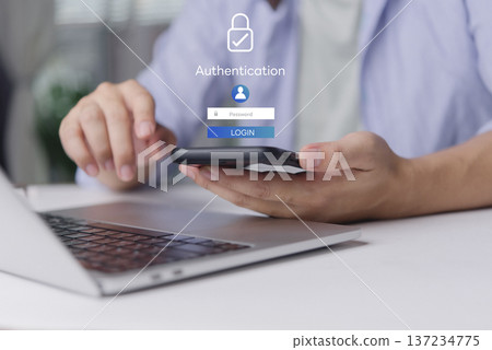 User secure login authentication password. Cybersecurity concept data protection. Man hand using smartphone laptop desk. Virtual screen padlock icon internet technology privacy. User secure login authentication password. Cybersecurity concept data protection. Man hand using smartphone laptop desk. Virtual screen padlock icon internet technology privacy. 137234775