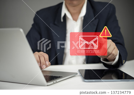Businessman working laptop desk receive harmful email warning. Phishing scam malware virus alert icon. Cybersecurity technology data protection network security internet crime concept. Businessman working laptop desk receive harmful email warning. Phishing scam malware virus alert icon. Cybersecurity technology data protection network security internet crime concept. 137234779