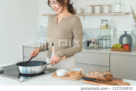 Making breakfast in the kitchen, Woman preparing breakfast Making breakfast in the kitchen, Woman preparing breakfast 137234833