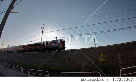 A train running with the sun at its back A train running with the sun at its back 137235307
