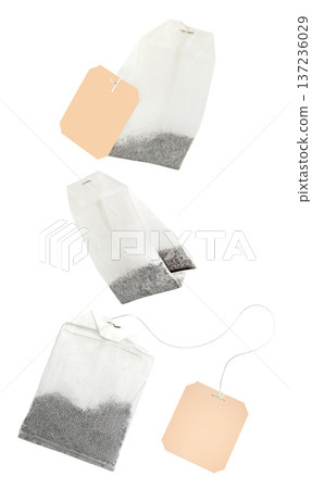 Tea bags, disposable, new, set, hanging, flying, soaring isolated on white background Tea bags, disposable, new, set, hanging, flying, soaring isolated on white background 137236029
